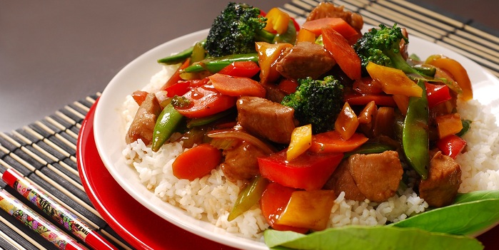 plate of pork stir fry with vegetables