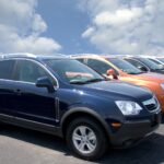 500px Photo ID: 98985513 - New fuel efficient SUV's on a car dealers lot for sale.